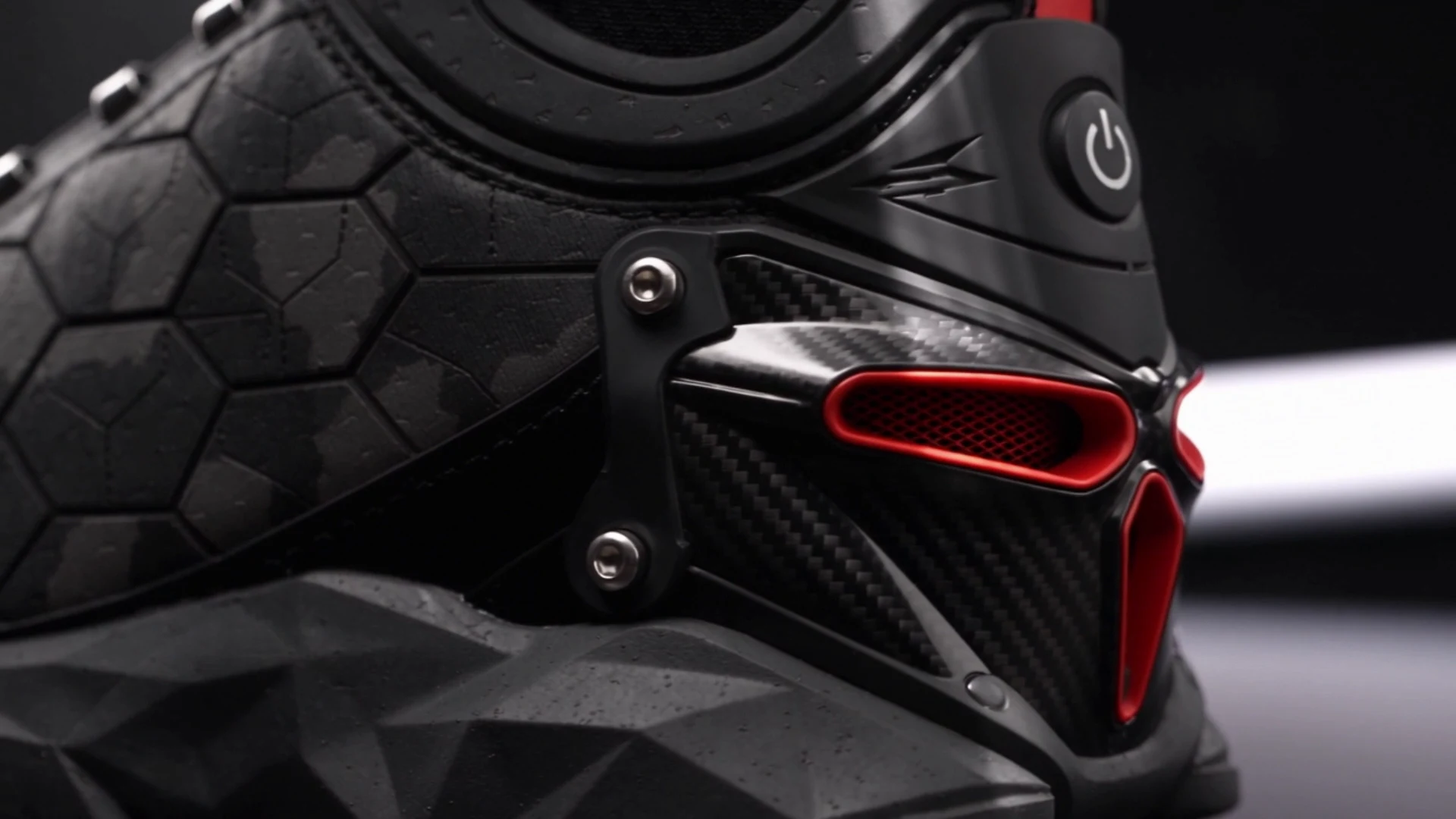 Close-up of AeroNED tactical concept materials and carbon-fiber heel from the supplied tactical film.